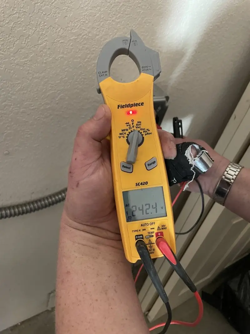 Voltage testing with clamp meter during Aluminum Wiring Replacement in Maquoketa